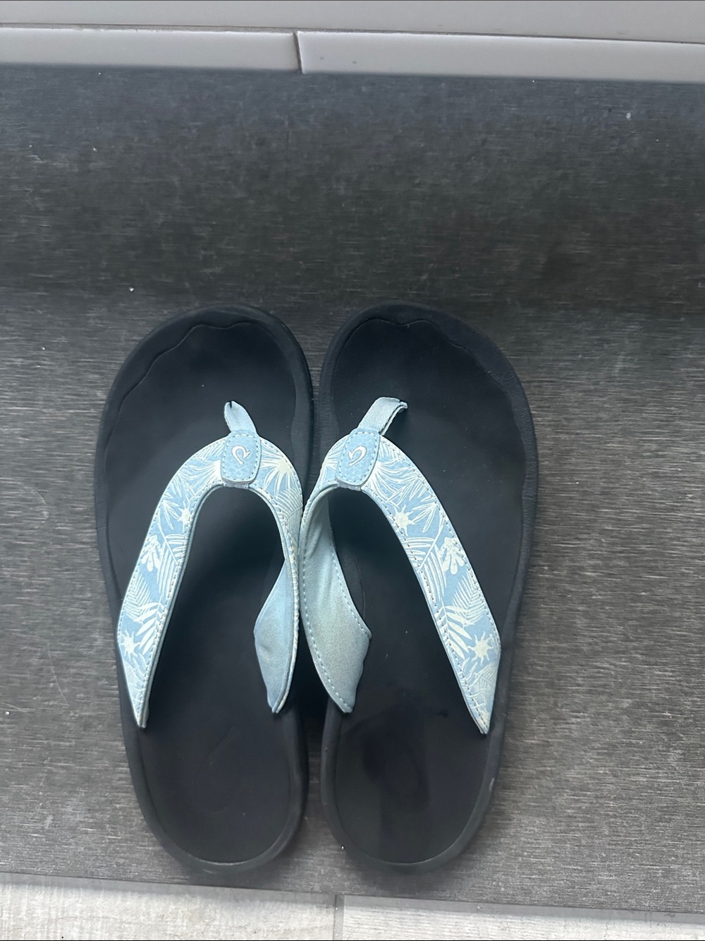 Olukai Women's Light Blue Patterned Strap Black Footbed Sandals